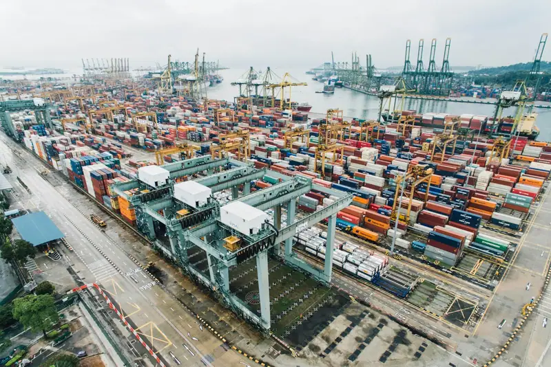 Aerial view of stacked shipping containers at a port
