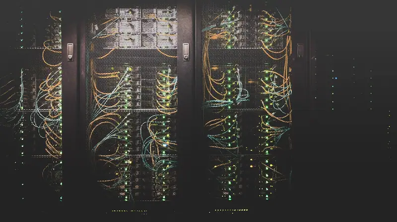 A corridor of server racks in a data centre